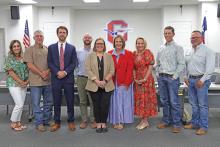 (THOMAS WALLNER | THE GRAHAM LEADER) Woodland Elementary School Principal Audra Barrett was hired as the new Graham Junior High School Principal after approval Wednesday, May 14 from the Graham ISD Board of Trustees. Shown from left to right are Lauren Mahaney, Brandon Bates, John Brown, Chris Blanton, Barrett, Dr. Mary Johnston, Kristina Pettus, Brandon Joy and Jason Smith.