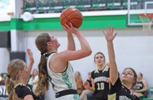 (THOMAS WALLNER | THE GRAHAM LEADER) Camren Mallory lines up a shot at the basket for the Ladycats during their game Tuesday, Feb. 4 against Woodson. The Ladycats are on 15-game winning streak and with the victory were perfect in district.