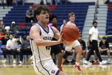 (ALEX HAVARDANSKY | THE GRAHAM LEADER) Brodie Martin looks to pass the ball to a teammate in one of the Steers’ previous matchups. Martin was one of the Steers athletes who earned first team all district honors for his efforts this season. 