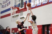 (ALEX HAVARDANSKY | THE GRAHAM LEADER) Bryce Martin puts up a one handed shot Tuesday, Feb. 10 against the Mineral Wells Rams. Martin along with his teammate Jagger Nees set the tone in the first quarter of the Steers’ 58-37 win to clinch a playoff spot. 