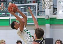 (THOMAS WALLNER | THE GRAHAM LEADER) Jacob Omundi has been an asset for the Bobcats team all season, utilizing his skills to bring crucial points on the board. Omundi led a dominating charge for Newcastle during their most recent matchup Tuesday, Feb. 4 against Woodson, with 18 points overall.