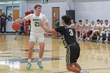 (ARCHIVE PHOTO | THE GRAHAM LEADER) Jayden Hemby looks for an open teammate during the Newcastle game against Woodson last season. The Bobcats opened their season with a three-day tournament from Thursday, Dec. 4 through Saturday, Dec. 6.