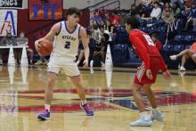 (ALEX HAVARDANSKY | THE GRAHAM LEADER) Bryce Martin one on one with a defender Friday, Feb. 13 against the Glen Rose Tigers. Martin was the second leading scorer in the game for the Steers with nine points. 