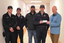(THOMAS WALLNER | THE GRAHAM LEADER) Members of Graham Fire Department presented a check Tuesday, Jan. 2 for $1,000 to Graham Regional Medical Center to be used for local breast cancer patients. Shown from left to right are Brandon Thomas, Cole Carlin, Daniel Webb, Cole Epperson and Shane Kernell. 