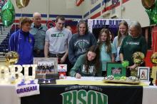 (THOMAS WALLNER | THE GRAHAM LEADER) Lillian Noble signs to play volleyball for Oklahoma Baptist University during a Graham High School athletes signing ceremony Wednesday, Feb. 5.