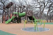 (THOMAS WALLNER | THE GRAHAM LEADER) The 'Inclusive Orbit' which is part of the new playground equipment at Firemen's Park. The new feature is currently inoperable after an accident occurred Thursday, Dec. 28 where a 5-year-old Throckmorton girl was injured.