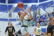 (THOMAS WALLNER | THE GRAHAM LEADER) Camren Mallory makes a shot during the Ladycats bi-district matchup Monday, Feb. 10. Among other accolades, Mallory was named All District Defensive Player of the Year for her Ladycats basketball season performance.