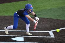 (ALEX HAVARDANSKY | THE GRAHAM LEADER) Jansyn Louder bunts the ball Tuesday, Feb. 17 against the Alvord Lady Bulldogs. Louder laid down a key bunt in the first inning in the first inning to put runners in scoring position in the 9-1 victory. 