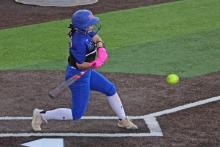 (ALEX HAVARDANSKY | THE GRAHAM LEADER) Kylie Pruitt swings at a ball in one of the Lady Blues’ previous matchups. Despite a loss Monday, Feb. 23 to Peaster, the offense for Graham was electric, putting up 14 runs in the game. 