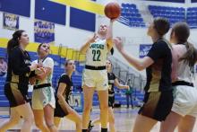 (ARCHIVE PHOTO | THE GRAHAM LEADER) Mattie Dollar of the Newcastle Ladycats runs past the Forestburg defense to make a shot near the net during a matchup Monday, Feb. 10. Dollar was a driving force for the team all season.