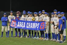 (ALEX HAVARDANKSY | THE GRAHAM LEADER)  The Graham Steers hold their area champs banner and trophy Friday, May 9. The Steers defeated the FW Castleberry Lions 7-3 in the second round. 