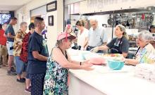 (ARCHIVE PHOTO | THE GRAHAM LEADER) Visitors to the Our Daily Bread program line up for a hot lunch at First United Methodist Church in Graham. The annual program will begin this year Monday, July 7 and run through Friday, Aug. 8.