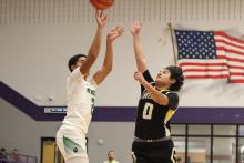(ALEX HAVARDANSKY | THE GRAHAM LEADER) London Martinez shoots a three pointer Monday, Feb. 23 against the Bellevue Eagles. Martinez led the charge in the second quarter with a pair of triples in the Bobcats’ bi-district matchup. 