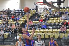 (ALEX HAVARDANSKY | THE GRAHAM LEADER) Brodie Martin puts up a layup Tuesday, Feb. 24 against the San Angelo Lake View Chiefs. Martin hit several breakaway layups late in the game to help seal the 38-32 win for the Steers. 