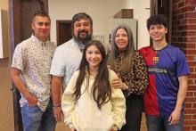 (THOMAS WALLNER | THE GRAHAM LEADER) Enoc Espinoza and his family pose for a picture after the unveiling of the LVN to ADN Simulation Center at the North Central Texas College Graham campus was named in his honor. Espinoza is the Chief Clinical Officer at Graham Regional Medical Center.