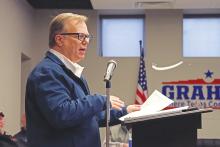 (ARCHIVE PHOTO | THE GRAHAM LEADER) (THOMAS WALLNER | THE GRAHAM LEADER) City Manager Eric Garretty speaks to the Graham City Council and members of the public in attendance at a budget meeting held Thursday, Feb. 13. An ordinance to increase the water and sewer rates was accepted for a first reading last week by the Graham City Council.