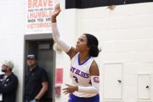(ALEX HAVARDANKSY | THE GRAHAM LEADER) Izzy Alejo hits a ball on a serve attempt Friday, Oct. 24, against the Mineral Wells Lady Rams. Alejo has consistently been a spark plug defensively and at the service line for the Lady Blues this year.