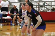 (ALEX HAVARDANKSY | THE GRAHAM LEADER) Makenzie Vacante, 7, and Hudson Wright, 14, prepare for a serve receive attempt Friday, Oct. 24, against the Mineral Wells Lady Rams.
