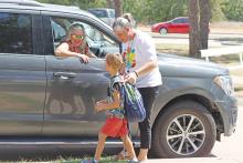 (ARCHIVE PHOTO | THE GRAHAM LEADER) Parents pick up students at Pioneer Elementary School for the first day of school for the 2023-2024 year. 