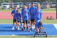 (ARCHIVE PHOTO | THE GRAHAM LEADER) Younger camp participants wait their turn on an obstacle course which tests speed and agility as part of Graham’s youth camp in 2024. Camps will begin this week in Graham and run through July.