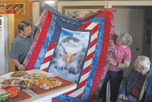 (ALEX HAVARDANSKY | THE GRAHAM LEADER) Young County veteran James Workman was presented a Quilt of Valor for his 23 year of military service in the U.S. Navy. Workman was presented the quilt Wedensday, Oct. 29 at his home.