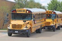 (ALEX HAVARDANSKY | THE GRAHAM LEADER) School buses line up at Crestview Elementary School on the first day of school to pick up students. The Graham ISD Board of Trustees approved the purchase of a new bus for the district Wednesday, Sept. 10.
