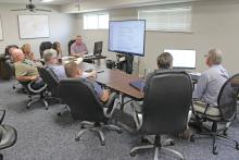 (TC GORDON | THE GRAHAM LEADER) Young County Commissioners and courthouse staff met Monday, Aug. 5 at the Young Central Appraisal District to go through the tax worksheet to come up with the proposed rate.