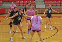 (ALEX HAVARDANSKY | THE GRAHAM LEADER) Adi Pinkston looks to pass to an available player Tuesday, May 20. In game one the Lady Blues beat the Lady Pirates 41-13 in a dominant performance.