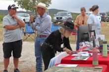 (THOMAS WALLNER | THE GRAHAM LEADER) Visitors come out to Mote Farm and Pea Ridge Pecans for an event Saturday, Oct. 25 held by a group in opposition to data centers in Young County. The property is adjacent to a proposed data center.
