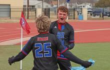 (THOMAS WALLNER | THE GRAHAM LEADER) Jace Gill celebrates with Easton Hedge after Hedge made a goal for the Steers during the first half of the game Friday, Feb. 21 against Bridgeport. Hedge was named District Offensive MVP with a school record of 26 goals scored.