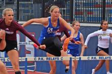 (ALEX HAVARDANSKY | THE GRAHAM LEADER) Braylee Mayes runs a tight race in the 100 meter hurdles at the district meets Thursday, April 3 at Newton Field. Mayes impressed in her performance as she qualified for area. 