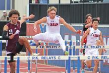 (ALEX HAVARDANSKY | THE GRAHAM LEADER) The Steers varsity track team competes in the 110 meter hurdles at district Thursday, April 3. The track and field teams had impressive performances throughout the days of the event.