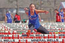 (ARCHIVE PHOTO | THE GRAHAM LEADER) Lady Blues senior Braylee Mayes has grown in the track and field program at Graham High School. Mayes has shown consistency with hurdles for four years and has seen the progress pay off with her achieving top marks in the last three competitions. 