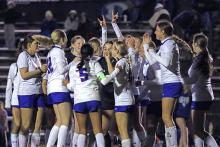 (KYLIE BAILEY | THE GRAHAM LEADER) The Lady Blues celebrate Tuesday, Feb. 10 on the field after defeating the Lady Eagles 5-4. With this win, the Lady Blues improve to 3-0 in district and take first place.