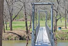 (ARCHIVE PHOTO | THE GRAHAM LEADER) The bridge over Salt Creek at Firemen's Park in Graham. The park is one of three options being considered for a potential kayak launch along with Salt Creek Park and a location near Ribble Road.