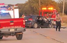 (THOMAS WALLNER | THE GRAHAM LEADER) A tow truck picks up a 2017 Dodge Journey driven by Denny Ray Meeks, of Graham, that was involved in a two-vehicle wreck on Hwy. 380. A preliminary investigation stated the wreck occurred Thursday, Nov. 14 when Meeks struck the back end of a 2012 Mack Truck.