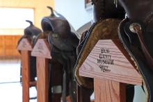 (THOMAS WALLNER | THE GRAHAM LEADER) Custom saddle racks holding the Eddleman brothers’ saddles at the Young County Museum of History and Culture. The museum is looking to open to the public on Labor Day weekend in 2025.