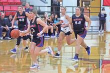 (ARCHIVE PHOTO | THE GRAHAM LEADER) Graham’s Mayci Ryans (3) brings the ball up the court in transition with teammates around her during a game earlier in the season. The Lady Blues picked up another victory Tuesday, Dec. 10 over the Windthorst Trojanettes. 