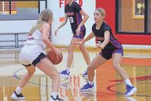 (ARCHIVE PHOTO | THE GRAHAM LEADER) The Lady Blues’ Ava Street (11) keeps her eye on the player in front of her during a game earlier in the season. The Lady Blues came out on top in a 54-51 victory Tuesday, Dec. 17 against San Angelo Central.