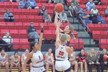 (ARCHIVE PHOTO | THE GRAHAM LEADER) Briley Randall puts up a shot over the arms of a couple of Eastland defenders during a game earlier in the season. Randall led in scoring this week in the final non-district game Monday, Dec. 30 against San Angelo.