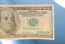 (THOMAS WALLNER | THE GRAHAM LEADER) The counterfeit bill shown was used to make a purchase in Graham this week. Looking into the sunlight with the $100 bill shows Alexander Hamilton, which is only present on $10 bills. 