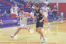 (TC GORDON | THE GRAHAM LEADER) Steers guard Bryce Martin drives to the hoop past a Millsap defender Tuesday, Nov. 19 during Graham’s 51-40 win over the Bulldogs in the first game of the season.