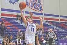 (ARCHIVE PHOTO | THE GRAHAM LEADER) The Steers’ Cooper Wilde gets fouled as he puts up a layup attempt at a game earlier in the season. The Steers came back to secure a 55-54 win Tuesday, Dec. 17 over the Iowa Parks Hawks. 