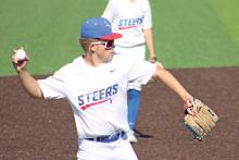 (ALEX HAVARDANSKY | THE GRAHAM LEADER) Dylan Cox picks up a ground ball at third base to make the out against the Mineral Wells Rams in the afternoon Tuesday, April 8. Cox was a bright spot in the infield for the Steers.