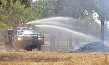 (ARCHIVE PHOTO | THE GRAHAM LEADER) A Newcastle Volunteer Fire Department truck works a fire in July 2023 in Young County. The department was awarded a $25,000 grant through the Rural Volunteer Fire Department Assistance Program with Texas A&M Forest Service.