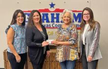 (WETA PHILLIPS | CONTRIBUTED PHOTO) The Friends of the Library recently contributed $5,500 to the Library of Graham to be used for a new book display and book drop carts. Shown from left to right are Library Board Member Erin Collins, Library Director DeAnna Bullock, FOL Treasurer Weta Phillips and Library Board President Stefani Schutz. 
