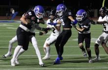 (ALEX HAVARDANSKY | THE GRAHAM LEADER) Jacob Alexander runs through Knights defenders Friday, Nov. 7 against Eagle Mountain. Alexander was effective in the receiving game marching the Steers down field and pushing through defenders.