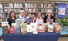 (THOMAS WALLNER | THE GRAHAM LEADER) The Silas Morton Chapter of the Daughters of the American Revolution donated funding to purchase books on the American Revolution. Shown from left to right are Library Director DeAnna Bullock and Silas Morton DAR members Anne Heartfield, Betsy Casteel, Ellen Morris, Sandra Birdwell and Linda Swan.