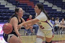 (ALEX HAVARDANSKY | THE GRAHAM LEADER) Maddyx Marin looks to pass the ball to one of her teammates in the Lady Blues season opener. Marin hit a pair of jumpshots and a free throw in the Lady Blues win Saturday, Nov. 15 over the Lady Leopards.