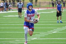 (ALEX HAVARDANSKY | THE GRAHAM LEADER) Parker Hale runs away from the defense for a walk in touchdown Saturday, May 31. Hale has emerged over the past several weeks as an elusive receiving threat in the passing game for Graham.